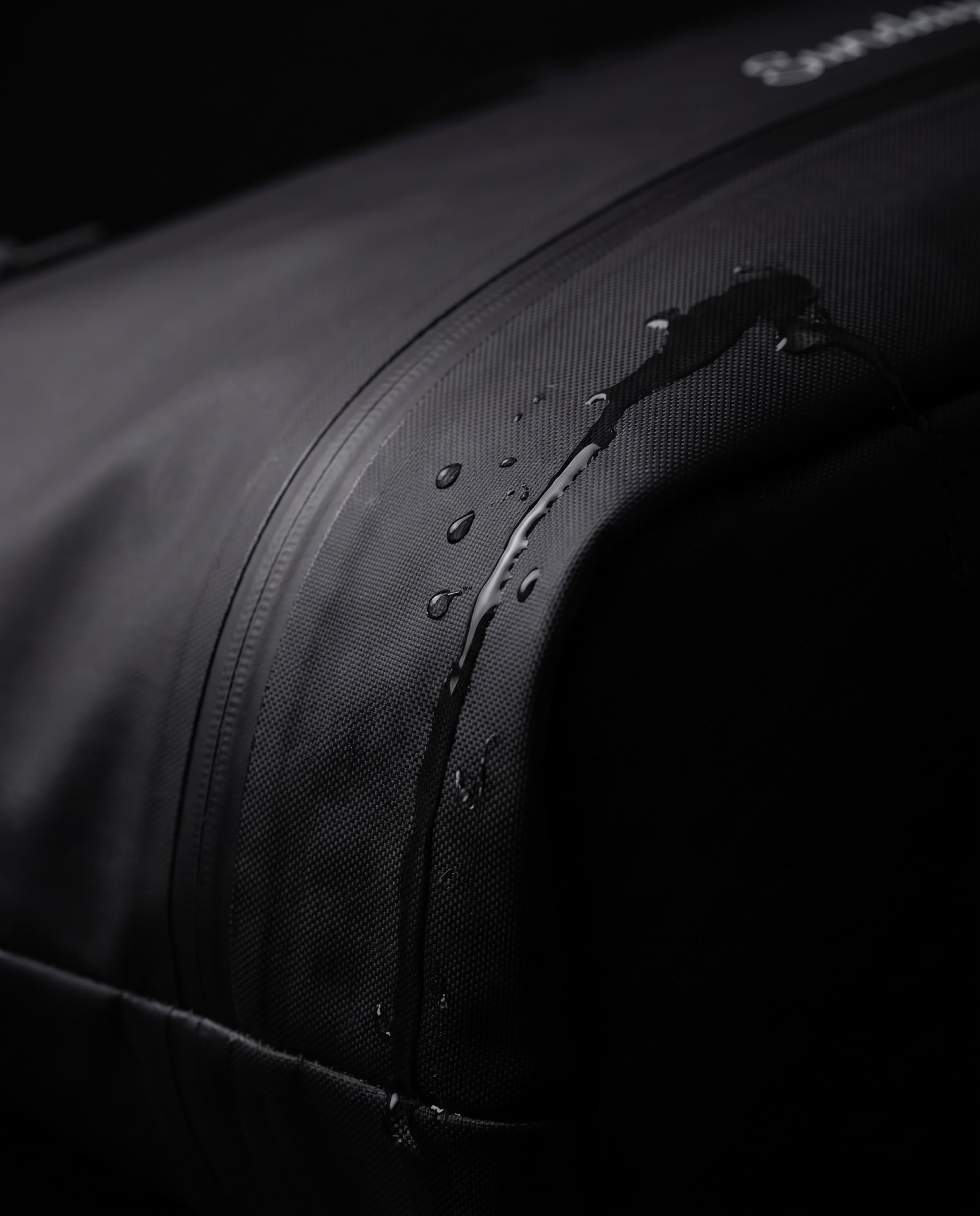 Macro of the TPU-coated nylon at a welded seam with water beading on the surface